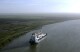 FILE - A ship moves through the Sacramento-San Joaquin River Delta near Bethel Island, Calif., March 12, 2008. California Gov. Gavin Newsom's administration now says it will cost more than $20 billion to build a giant tunnel so the state can catch more water when it rains and store it to better prepare for longer droughts caused by climate change. (Ǻ Photo/Rich Pedroncelli, File)