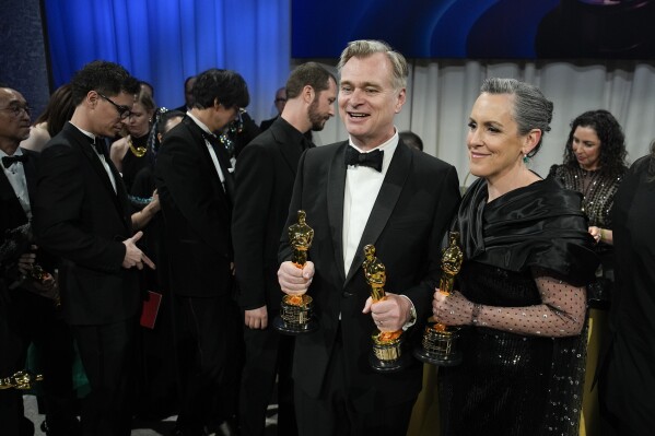 Christopher Nolan, winner of the awards for best director and best picture for "Oppenheimer," left, and Emma Thomas, winner of the award for best picture for "Oppenheimer" pose at the Governors Ball after the Oscars on Sunday, March 10, 2024, at the Dolby Theatre in Los Angeles. (AP Photo/John Locher)