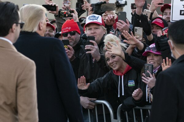 President Donald Trump greets an overflow crowd before speaking at a campaign rally at Rochester International Airport, Friday, Oct. 30, 2020, in Rochester, Minn. (AP Photo/Alex Brandon)