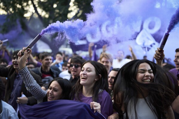 Supporters of Argentina's President Javier Milei celebrate during the closing campaign rally for Manuel Adorni, a contender in the upcoming elections for the Buenos Aires city legislature, in Buenos Aires, Argentina, Wednesday, May 14, 2025. (AP Photo/Rodrigo Abd)