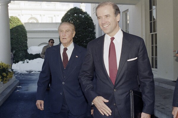 FILE - Chairman of the Senate Judiciary Committee, Joe Biden (D-Del.), right, and the former chairman of the panel, Sen. Strom Thurmond (R-S.C.), depart the West Wing of White House in Washington, Nov. 12, 1987, after meeting with President Reagan. On Sept. 1, 2023, The Associated Press reported on President Biden’s inaccurate claim that he “literally” convinced Thurmond, a segregationist, to vote in favor of the Civil Rights Act. (AP Photo/Ira Schwarz, File)