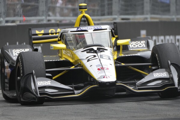 Colton Herta (26) drives during the IndyCar Detroit Grand Prix auto race in Detroit, Sunday, June 2, 2024. (AP Photo/Paul Sancya)