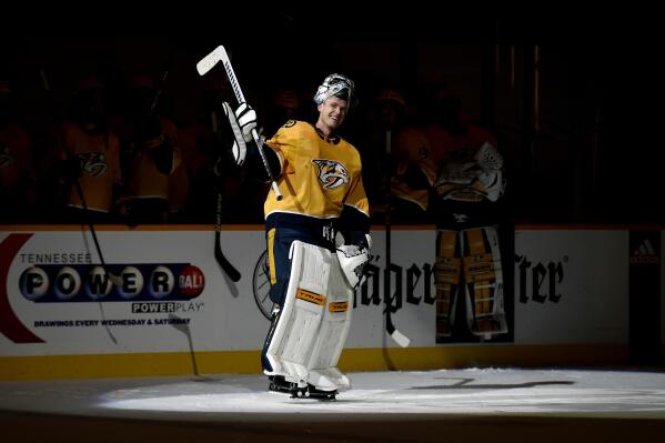 Nashville Predators goaltender Pekka Rinne (35) waves to the crowd during a standing ovation after the Predators defeated the Carolina Hurricanes in an NHL hockey game Monday, May 10, 2021, in Nashville, Tenn.(AP Photo/Mark Zaleski)