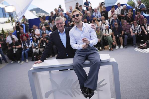Director Sergey Loznitsa, Links and Aleksandr Kuznetsov poses for photographers in the photo call for the film 'Two prosecutor