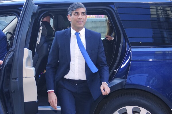 Britain's Prime Minister Rishi Sunak arrives at the TV studios in Manchester, England, Tuesday, June 4, 2024. Rishi Sunak, leader of the Conservative Party, and Keir Starmer, leader of the Labour Party, are preparing to face off in the first head-to-head TV debate of the election. (AP Photo/Jon Super)