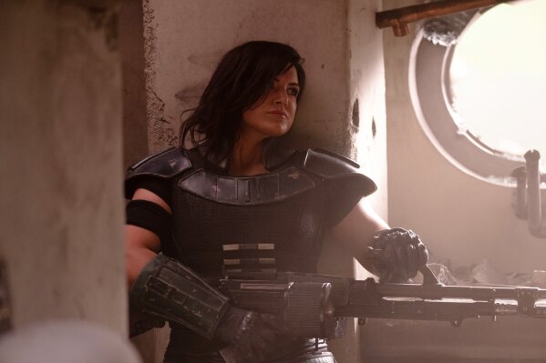 This image released by Disney Plus shows Gina Carano in a scene from "The Mandalorian." The ambitious eight episode show with the budget of a feature film is one of the marquee offerings of the Walt Disney Co.’s new streaming service, Disney Plus, which launches Nov. 12. (Melinda Sue Gordon/Disney Plus via AP)