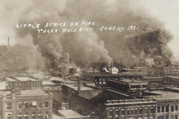 This photo provided by the Department of Special Collections, McFarlin Library, The University of Tulsa shows fires burning during the Tulsa Race Massacre in Tulsa, Okla., on June 1, 1921. (Department of Special Collections, McFarlin Library, The University of Tulsa via AP)