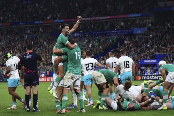 Ireland celebrate as they defeat South Africa during the Rugby World Cup Pool B match between South Africa and Ireland at the Stade de France in Saint-Denis, outside Paris, Saturday, Sept. 23, 2023. (AP Photo/Aurelien Morissard)