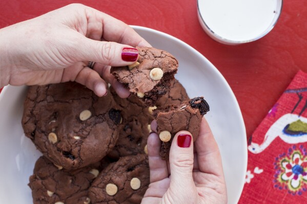 This 2017 image provided by Katie Workman shows chocolate brownie cookies with dried cherries and white chocolate chips in New York. (Katie Workman via AP)