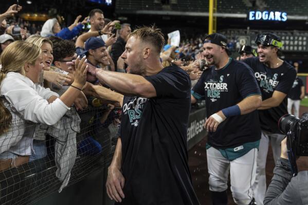 Seattle Mariners 'Jesse Winker (27) celebrates with Dylan Moore (25) after  hitting a solo home run against the Oakland Athletics during the seventh  inning of a baseball game in Oakland, Calif., Tuesday
