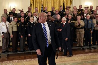 
              In this Sept. 5, 2018, photo, President Donald Trump responds to a reporters question during an event with sheriffs in the East Room of the White House in Washington. (AP Photo/Susan Walsh)
            