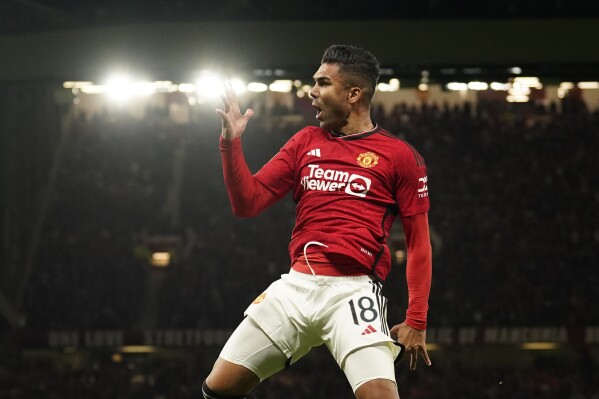 Manchester United's Casemiro celebrates after scoring his side's second goal during the English League Cup third round soccer match between Manchester United and Crystal Palace at Old Trafford stadium in Manchester, England, Tuesday, Sept. 26, 2023. (AP Photo/Dave Thompson)
