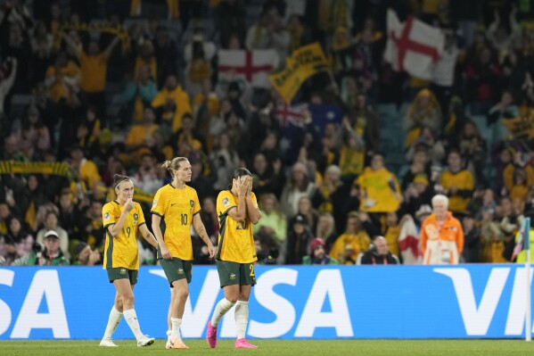 From left: Australia's Caitlin Foord, Emily Van Egmond and Sam Kerr walk after the Women's World Cup semifinal soccer match between Australia and England at Stadium Australia in Sydney, Australia, Wednesday, Aug. 16, 2023. (AP Photo/Abbie Parr)