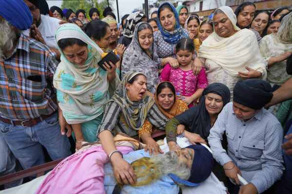 Relatives mourn near the body of Amarjeet Singh, 51, killed in Pakistani artillery shelling in Poonch along the Line of Control, Indian-controlled Kashmir, May 8, 2025. (AP Photo/Channi Anand)