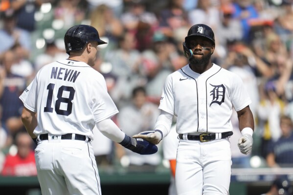 Detroit Tigers' Akil Baddoo celebrates his two-run home run with Tyler Nevin (18) against the Cincinnati Reds in the fourth inning of a baseball game, Thursday, Sept. 14, 2023, in Detroit. (AP Photo/Paul Sancya)