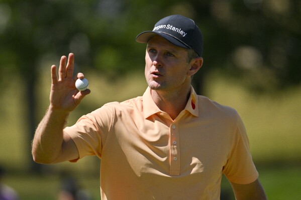 Justin Rose, of England, waves after making a putt on the ninth hole during the final round of the PGA Championship golf tournament at the Valhalla Golf Club, Sunday, May 19, 2024, in Louisville, Ky. (AP Photo/Jon Cherry)