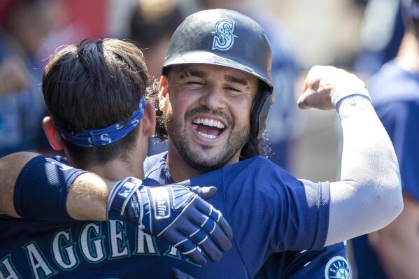 Sam Haggerty and Julio Rodriguez of the Seattle Mariners smile as