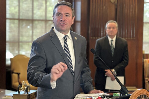 Missouri Attorney General Andrew Bailey speaks to reporters, Thursday, Aug. 1, 2024, at the Capitol in Jefferson City, Mo. Bailey has opposed efforts to release people from prison after courts have overturned their murder convictions. (AP Photo/David A. Lieb)