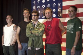 FILE - Pearl Jam members, from left, Mike McCready, Matt Cameron, Eddie Vedder, Jeff Ament and Stone Gossard appear at a news conference in Mexico City, on July 17, 2003.  Pearl Jam should be on the road celebrating 30 years of “Ten” with a tour.  Pearl Jam’s postponed European tour was rescheduled for June and July 2022. The delay not only put any plans to celebrate “Ten” on hold, Pearl Jam has still yet to tour in support of last year’s release, “Gigaton.” (AP Photo/Jaime Puebla, File)