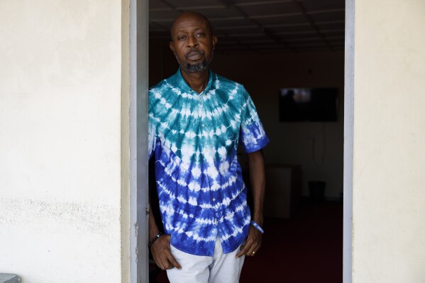 Habib Taigore Kamara, Executive Director of Sierra Leone's Youth Development and Child Link (SLYDCL), stands in his office in Freetown, Sierra Leone, Thursday, April 25, 2024. Habib's organisation provides medical care and psychological support for drug users in Sierra Leone. (AP Photo/ Misper Apawu)
