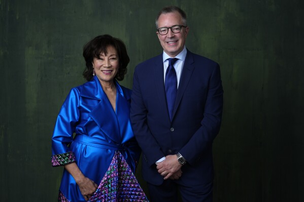 President of the Academy of Motion Picture Arts and Sciences Janet Yang, left, and CEO of the Academy of Motion Picture Arts and Sciences Bill Kramer poses for a portrait during the 96th Academy Awards Oscar nominees luncheon on Monday, Feb. 12, 2024, at the Beverly Hilton Hotel in Beverly Hills, Calif. (AP Photo/Chris Pizzello)