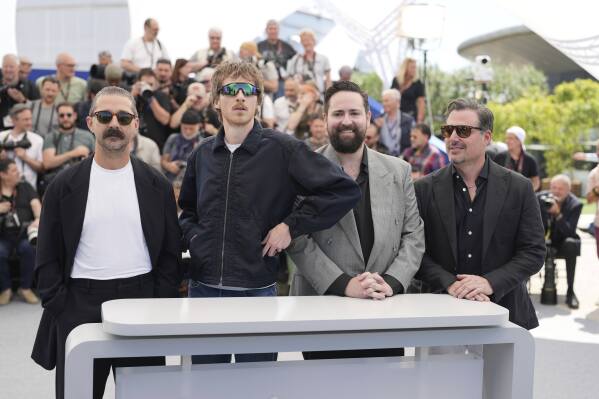 Shia LaBeouf, from left, director Leo Lewis O'Neil, producer Matt Zien and producer Kevin Knight pose for photographers at the photo call for the film 'Slauson Rec' at the 78th international film festival, Cannes, southern France, Sunday, May 18, 2025. (AP Photo/Natacha Pisarenko)