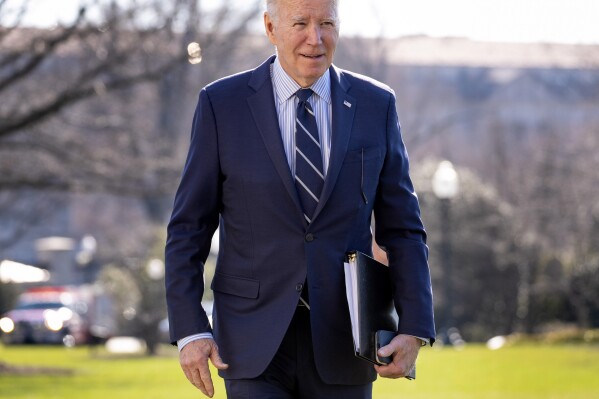 President Joe Biden walks toward members of the media as he arrives at the White House in Washington, Monday, Feb. 19, 2024, after returning from Rehoboth Beach, Del. (AP Photo/Andrew Harnik)