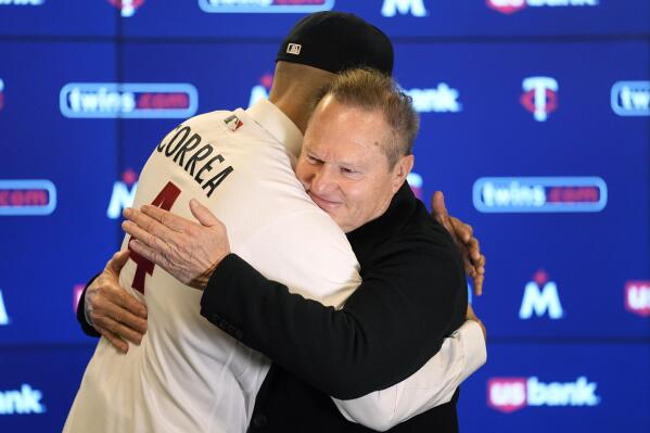 Minnesota Twins' Carlos Correa, left, and agent Scott Boras hug following a baseball press conference at Target Field, Wednesday, Jan. 11, 2023, in Minneapolis. The team and Correa agreed to a six-year, $200 million contract. (AP Photo/Abbie Parr)