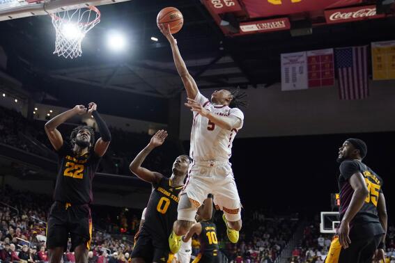 Southern California guard Boogie Ellis (5) drives to the basket against Arizona State during the second half of an NCAA college basketball game Saturday, March 4, 2023, in Los Angeles. (AP Photo/Marcio Jose Sanchez)