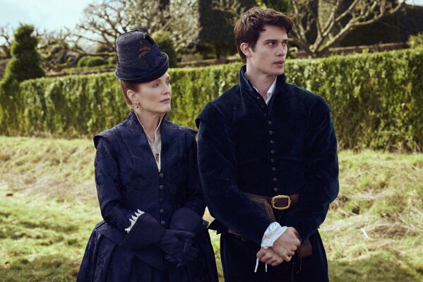 This image released by Starz shows Julianne Moore, left, and Nicholas Galitzine in a scene from "Mary & George." (Sky UK/Starz via AP)