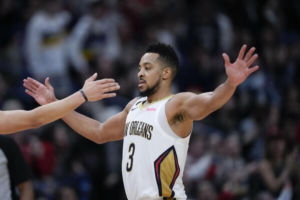 New Orleans Pelicans guard CJ McCollum (3) celebrates one of his 3-point baskets in the second half of an NBA basketball game against the San Antonio Spurs in New Orleans, Thursday, Dec. 22, 2022. The Pelicans won 126-117. (AP Photo/Gerald Herbert)