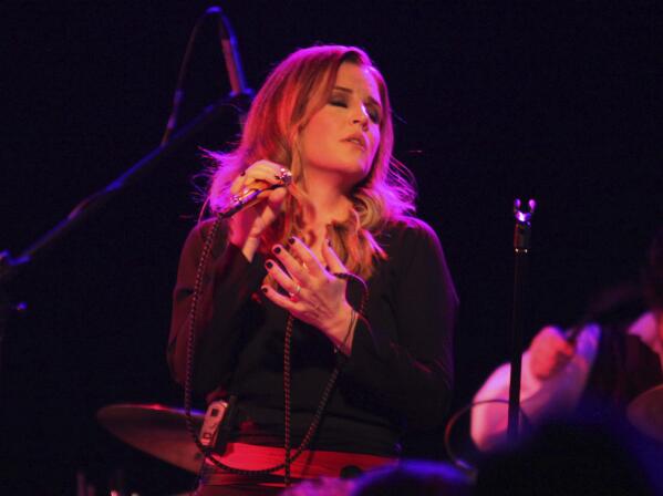 FILE - Lisa Marie Presley performs during her Storm & Grace tour on June 20, 2012, at the Bottom Lounge in Chicago. She was dubbed a “rock princess,” but Lisa Marie Presley staked her own musical claim as a singer-songwriter, allowing her to express herself apart, but sometimes alongside, from her iconic lineage.(Photo by Barry Brecheisen/Invision/AP, File)