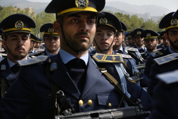 Iranian army members march during Army Day parade at a military base in northern Tehran, Iran, Wednesday, April 17, 2024. In the parade, Iranian President Ebrahim Raisi warned that the 