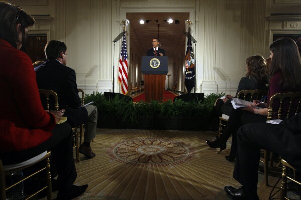 FILE - In this Feb. 9, 2009, file photo President Barack Obama delivers opening remarks during his first prime time televised news conference in the East Room of the White House in Washington. (AP Photo/Charles Dharapak, File)