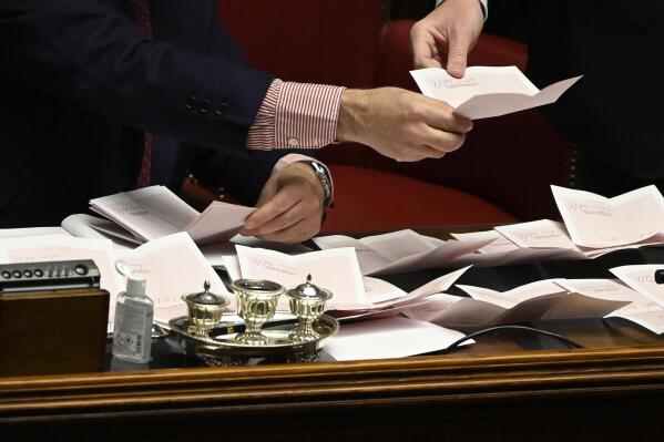 Ballots are counted in the Italian parliament in Rome, Wednesday, Jan. 26, 2022. The first two rounds of voting in Italy's Parliament for the country's next president yielded an avalanche of blank ballots, as lawmakers and special regional electors failed to deliver a winner amid a political stalemate. (Alberto Pizzoli/Pool photo via AP)