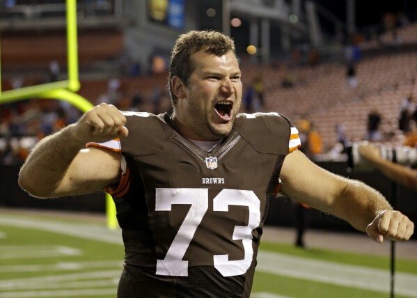 FILE - Cleveland Browns tackle Joe Thomas celebrates after a 24-6 win over the Detroit Lions in a preseason NFL football game in Cleveland. Aug. 15, 2013. Elected for enshrinement in his first year of eligibility, Joe Thomas will be introduced by his wife, Annie, and their four children, before he's the fitting closing speaker on Saturday in Tom Benson Hall of Fame Stadium, which will be overrun by Browns fans. (AP Photo/Tony Dejak, File)