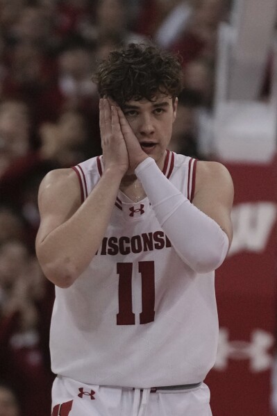 Wisconsin's Max Klesmit reacts after his three pointer during the second half of an NCAA college basketball game Tuesday, Feb. 20, 2024, in Madison, Wis. (AP Photo/Morry Gash)