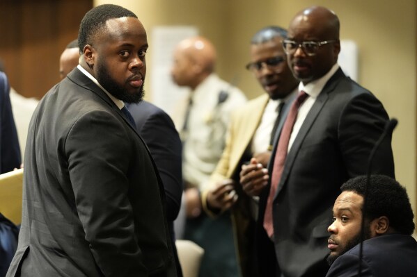 Former Memphis Police Officers Tedarrius Bean, left, and Demetrius Haley, right, two of three former Memphis officers charged with fatally beating Tyre Nichols in 2023, wait in the courtroom during a recess of their trial, Wednesday, April 30, 2025, in Memphis, Tenn. (AP Photo/George Walker IV, Pool)