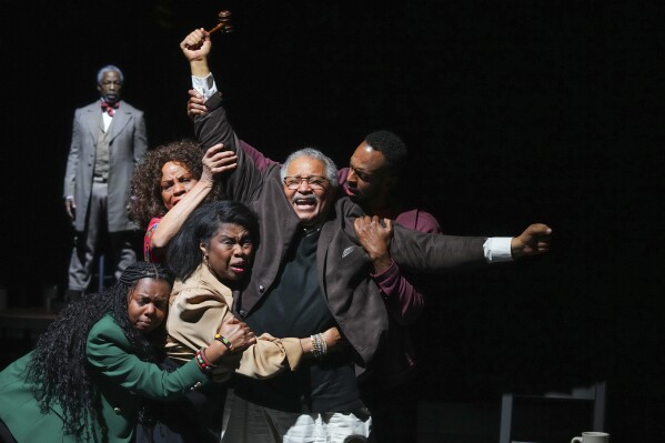 This image shows Count Sovall, center, with the cast during a performance of "American Rot," playing through March 31 at the Ellen Stewart Theatre in New York. (Steven Pisano/Sam Rudy Public Relations via AP)