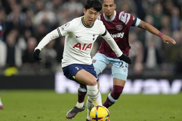 Tottenham's Son Heung-min in action against West Ham's Thilo Kehrer during the English Premier League soccer match between Tottenham Hotspur and West Ham United at Tottenham Hotspur stadium in London, Sunday, Feb. 19, 2023. (AP Photo/Kirsty Wigglesworth)