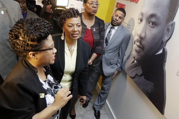 
              Rev. Bernice King, second from left, daughter of the late civil rights leader Rev. Martin Luther King Jr., tours an exhibit at the National Civil Rights Museum, Monday, April 2, 2018, in Memphis, Tenn. The museum was formerly the Lorraine Motel, where Rev. Martin Luther King Jr. was assassinated April 4, 1968. (AP Photo/Mark Humphrey)
            