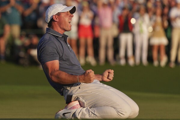 Rory McIlroy wins Masters playoff to complete the career Grand Slam | AP News