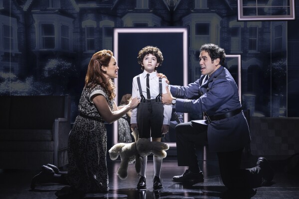This image released by Boneau/Bryan-Brown shows, from left, Alison Luff, Olive Ross-Kline and Adam Jacobs during a performance of "The Who's Tommy." (Matthew Murphy and Evan Zimmerman/Boneau/Bryan-Brown via AP)