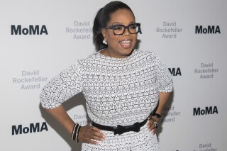 FILE - In this March 6, 2018 file photo, Oprah Winfrey attends The Museum of Modern Art's David Rockefeller Award Luncheon honoring Oprah Winfrey at the Ziegfeld Ballroom in New York. Winfrey is leaving WeightWatchers board of directors and donating all of her interest in the company to a museum. Shares of WW International Inc. tumbled more than 23% in Thursday, Feb. 29, 2024 trading. (Photo by Charles Sykes/Invision/AP, File)