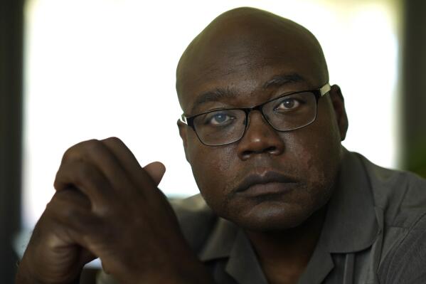 Terrence Hersey sits for a portrait at his home Friday, June 17, 2022, in South Holland, Ill. Hersey underwent extensive rehabilitation for a stroke in 2015, before his doctors eventually cleared him to return to work in 2016. But Union Pacific decided without ever having a doctor examine him that the stroke made him unfit to work for the railroad. Union Pacific has already lost three lawsuits over the way it dismisses employees with health conditions because of safety concerns, and the prospect of hundreds more similar lawsuits, including Hersey's case, looms over the railroad. (AP Photo/Charles Rex Arbogast)