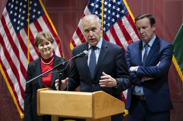 Senator Thom Tillis, co-chair of the Senate NATO Observer Group speaks, during a press conference, in Budapest, Sunday, Feb. 18, 2024. Two U.S. senators will submit a bipartisan resolution to Congress condemning democratic backsliding in Hungary and urging its nationalist government to lift its block on Sweden's accession into the NATO military alliance. The resolution, authored by U.S. Sens. Jeanne Shaheen, a New Hampshire Democrat, and Thom Tillis, a North Carolina Republican, comes as Hungary's government is under increasing pressure to ratify Sweden's bid to join NATO, something it has delayed for more than 18 months. (AP Photo/Denes Erdos)