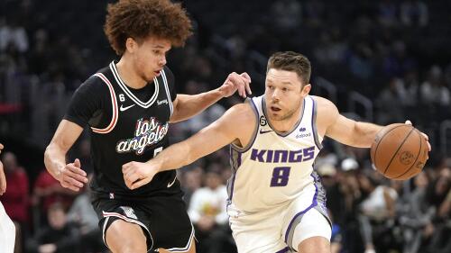 FILE -Sacramento Kings guard Matthew Dellavedova, right, drives by Los Angeles Clippers guard Jason Preston during the second half of an NBA basketball game Saturday, Dec. 3, 2022, in Los Angeles. Matthew Dellavedova is returning from the NBA to reunite with Melbourne United in Australia's National Basketball League. The 32-year-old guard agreed Wednesday to a two-year deal with United.(AP Photo/Mark J. Terrill, File)