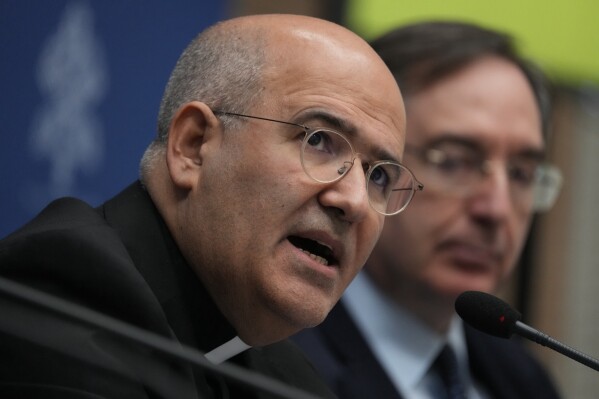 From left, Vatican Prefect of the Dicastery for Culture and Education, Card. José Tolentino de Mendonça and Giovanni Russo, head of the Italian Prison Administration attend a press conference at The Vatican, Monday, March 11, 2024, to present "With my Eyes", the Holy See pavillion for the 60th edition of the Venice Biennale of Arts opening on April 20th, 2024. (AP Photo/Domenico Stinellis)