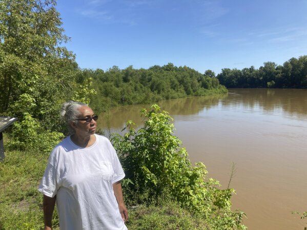 Reatha Jefferson looks out over the Great Pee Dee River on Monday, Aug. 17, 2020, Pamplico, SC. Dominion plans to build a new 14.5-mile-long gas line along the river and cites new energy demand spurred by economic growth in eastern South Carolina as the impetus for the project. Jefferson is one of several landowners protesting the pipeline because they are worried about its potential environmental effects. (AP Photo/Michelle Liu)