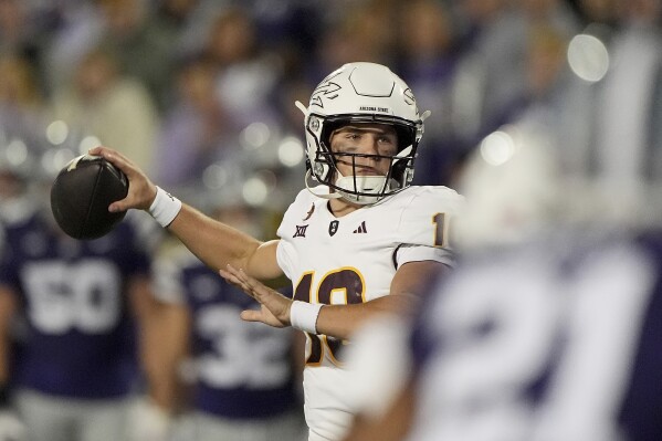 Arizona State quarterback Sam Leavitt looks to pass during the first half of an NCAA college football game against Kansas State Saturday, Nov. 16, 2024, in Manhattan, Kan. (AP Photo/Charlie Riedel)